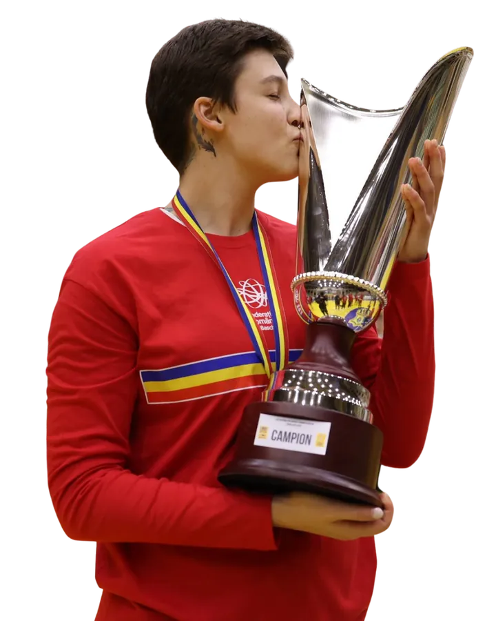 Laura kissing the national-championship trophy in her team jersey